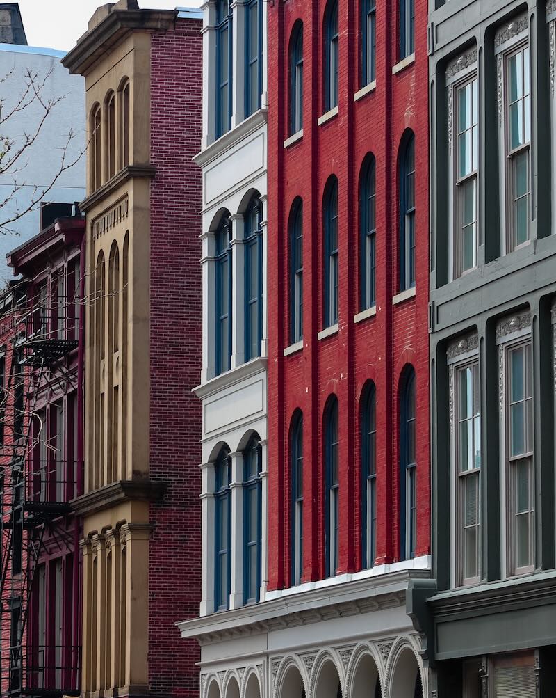 Multicoloured brick apartment building in a row 