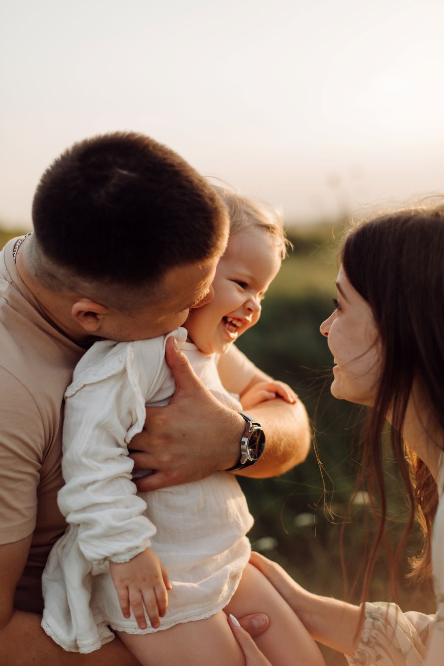 Parents playing with their small child